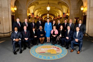 2015 Cook County Board members: Standing: Larry Suffredin, Greg Goslin, Jerry Butler, Robert Steele, President Toni Preckwinkle, John Daley, Jesus Garcia, Peter Silvestri, John Fritchey, Stanley Moore. Seated: Richard Boykin, Jeffrey Tobolski, Joan Patricia Murphy, Deborah Sims, Liz Gorman, Bridget Gainer, Tim Schneider, Luis Arroyo Jr