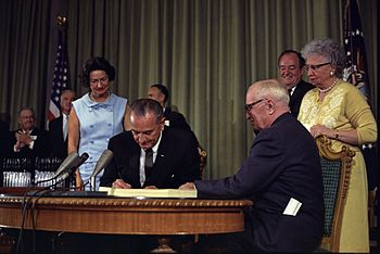 English: President signing the Medicare Bill a... English: President signing the Medicare Bill a...