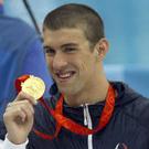 English: U.S. swimmer Michael Phelps shows off...