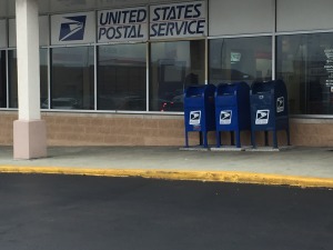 US Post office at 151st and LaGrange Road in Orland Park. Although the curbs are painted yellow designating no parking, cars pile up here blocking the roadway and causing traffic jams as drivers leave their cars running not only to drop letters int he mail boxes but to put them inside the post office.