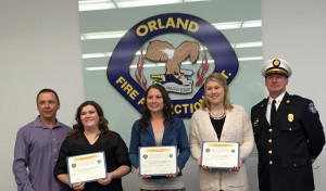 OFPD President Jim Hickey (left)  joins Fire Chief Ken Brucki (right) to Kayla Kutinac, Heather Elledge and Zoe Spada. (Photo courtesy OFPD)