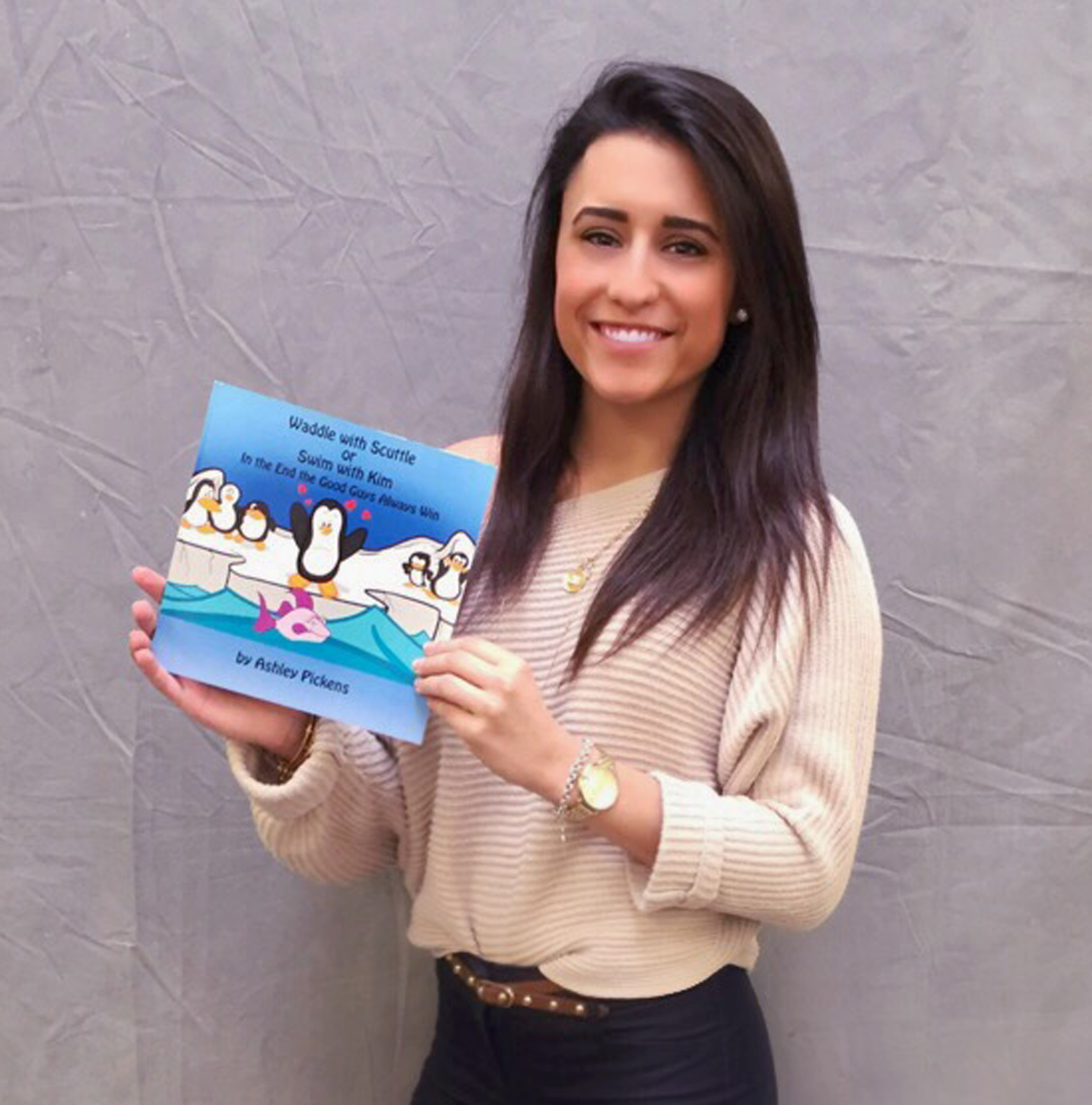 Children's author Ashley Pickens with her new illustrated book