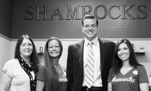 Lyons Mayor Getty poses with employees at a new business, the Shamrock Cafe, in Lyons