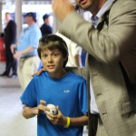 Aaron Hanania getting a baseball autograph at Wrigley Field