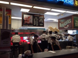 The crowded employee side of the counter at Portillos Restaurant in Orland Park