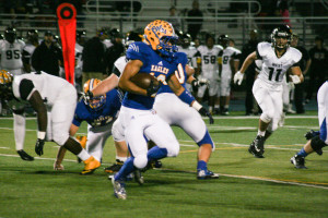 A Sandburg player carries the ball in the 1st half. Sandburg defeats Joliet West 35-14 Friday Oct. 9, 2015. Copyright (C) Steve Neuhaus 2015. All Rights Reserved