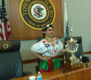 (Picture: Cynthia Dorantes, Queen of the Cicero 10th Anniversary celebration of Cinco de Mayo, poses with the Dominick Cup Trophy that will be presented to the winning team on Sunday May 8 at Toyota Park, capping the weekend long celebrations in honor of Mexican Independence. Photo courtesy The Town of Cicero)