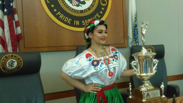 (Picture: Cynthia Dorantes, Queen of the Cicero 10th Anniversary celebration of Cinco de Mayo, poses with the Dominick Cup Trophy that will be presented to the winning team on Sunday May 8 at Toyota Park, capping the weekend long celebrations in honor of Mexican Independence. Photo courtesy The Town of Cicero)