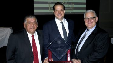 Lyons Village President Christopher Getty was named 2016 Man of the Year by the Illinois State Crime Commission for his efforts in passing the local Gun legislation which has become the basis for the Intergovernmental Agreement (IGA) on guns sales between Lyons and Cook County government. Picture (from left) Lyons Trustee Greg Ramirez, Lyons Village President Christopher Getty, and Lyons Trustee Dan Hilker. Photo courtesy Village of Lyons.