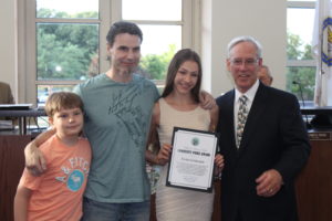 Evita Griskenas (2nd from right) with her father and brother at the Orland Park Village Board meeting Monday June 20, 2016