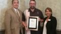 President Dominick, Town Building Department Recognized for Collaborative Efforts with Realtors and the Public. From left, Brian Bernardoni, Tom M. Tomschin, Alcia Ruiz