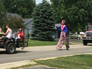 What;s a parade without a man on stilts?