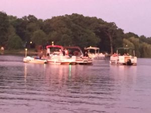 Some of the pontoon boats anchored in Candlewick Lake waiting for the sun to set and the 4th of July fireworks to begin
