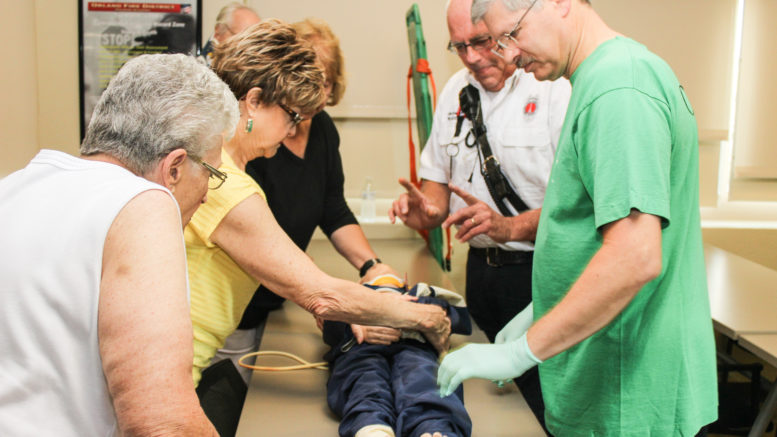 Lt. William Leddin (2nd from right) gives instructions to the first CERT Class on emergency responses August 10, 2016